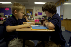 Two students use Rocket Math Worksheets to practice their math facts.