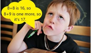 A student thinks through an equation by recalling their math facts.